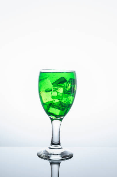 Fresh green nectar in clear glass with ice on food and drink concept.