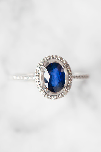 wedding ring  blue sapphire on a white background with clipping path