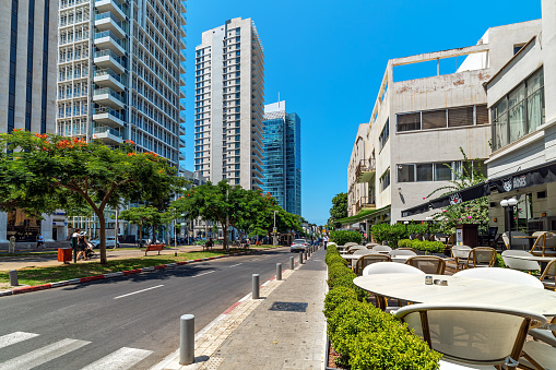 Tel Aviv, Israel - July 18, 2018: High-rise modern residential buildings on Rothschild Boulevard - one of the principal and expensive streets in the center of Tel Aviv, being one of the city's main tourist attractions.