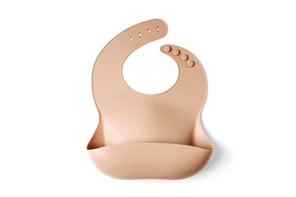 Brown silicone baby bib on white background. Top view, flat lay