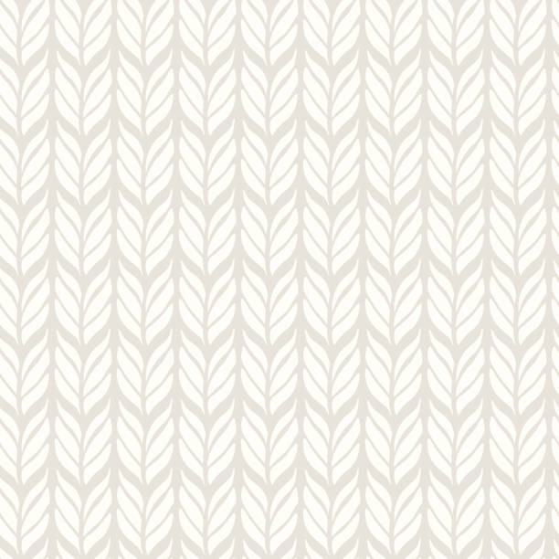 Knitting seamless pattern. Vector background with knitted woolen fabric in light color. Knitting seamless pattern. Vector background with knitted woolen fabric in light color. scandinavian stock illustrations