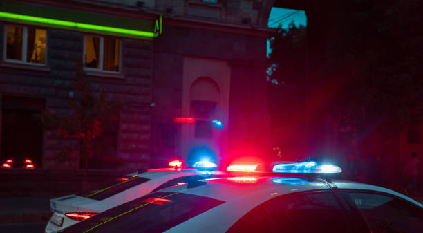 istock police car at night street 1400975589