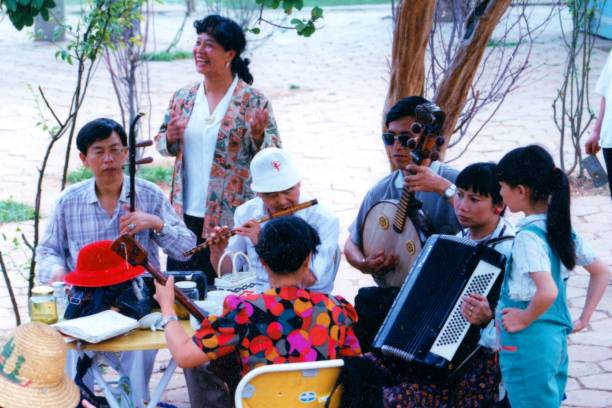 city park combines traditional chinese instruments and singing,in 1990s - erhu imagens e fotografias de stock
