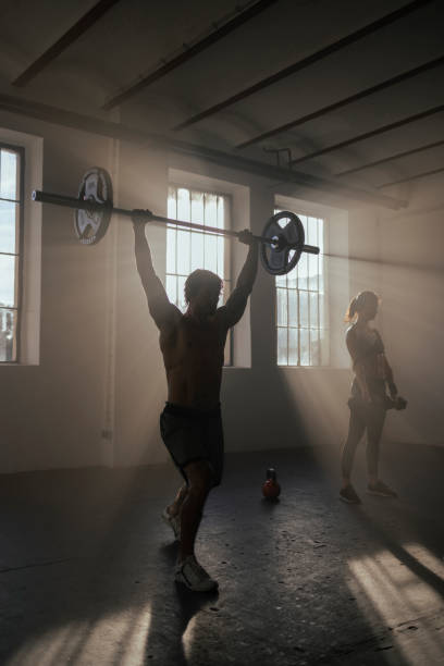 istock Lifting weights at the gym 1400980138