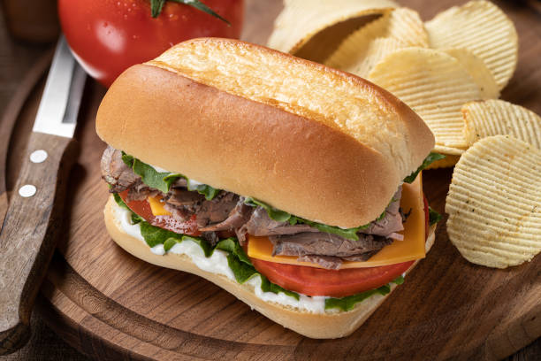 istock Roast beef sandwich with cheese, tomato and lettuce 1400980776