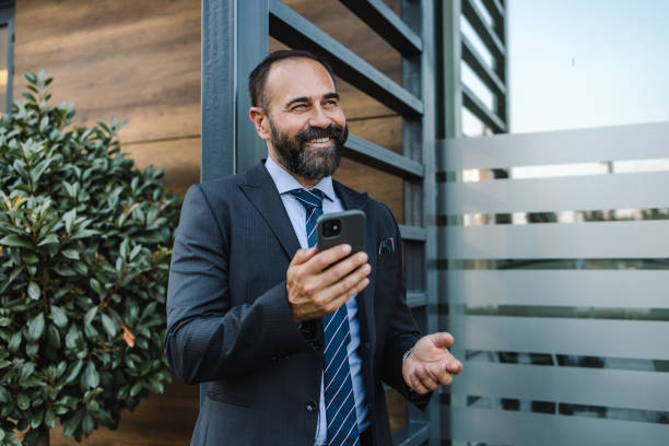 istock Male entrepreneur using mobile phone 1400982660
