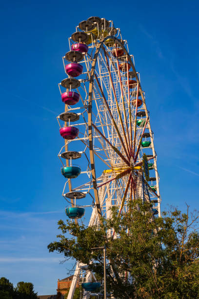 istock Ferris wheel against a clear blue sky 1400984634