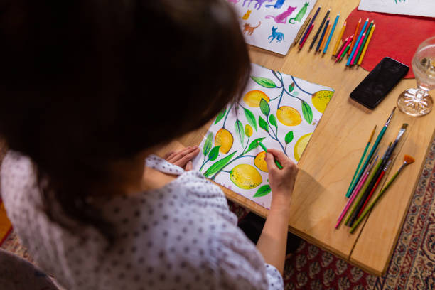 istock Woman making fruit illustration on the paper 1400985121