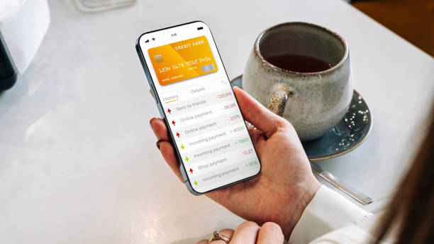 istock Mobile banking network. Smartphone with internet online bank application. Debit card wallet app. Save currency money wallet. 1400985929