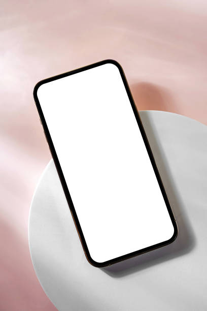 istock Smartphone with blank black screen. Mobile phone with a round geometric shape. Device screen mockup on minimal background for presentation or application design show. 1400985938