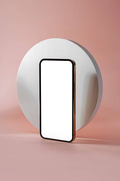 istock Smartphone with blank black screen. Mobile phone with a round geometric shape. Device screen mockup on minimal background for presentation or application design show. 1400985949