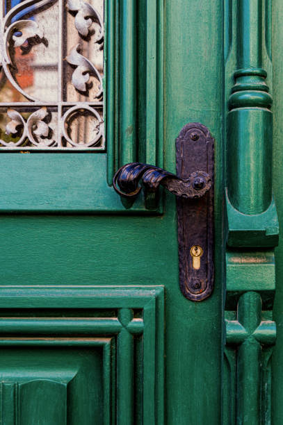istock Old wooden door and doorknob 1400987674