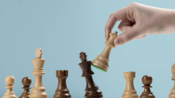 istock Player defeating his opponent and winning at chess 1400987743