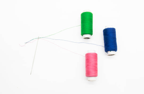 istock Colorful yarn on spool, yarn on tube, cotton, wool, linen thread, polyester selective focus on red spool 1400988033