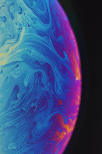 Close-up of rainbow colored soap bubble