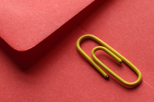 Paper clip on red envelope