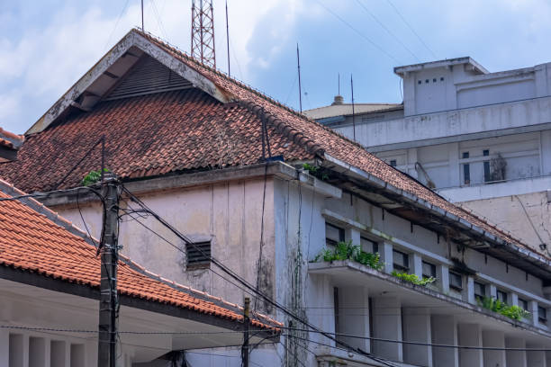 istock vintage and old white heritage building architecture under the clear and bright blue sky at Braga street Bandung 1400995042