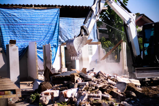 istock Excavator loads demolishing old home , construction site background 1400995341