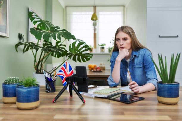 istock Remote distance learning, online lesson of female student using smartphone 1400996076