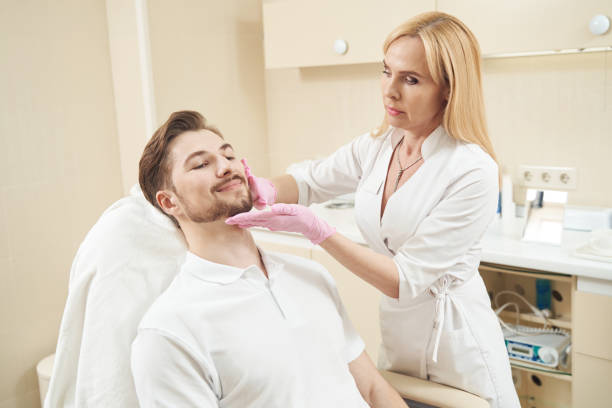 istock Beautician in aesthetic clinic performing face visual inspection 1400996566