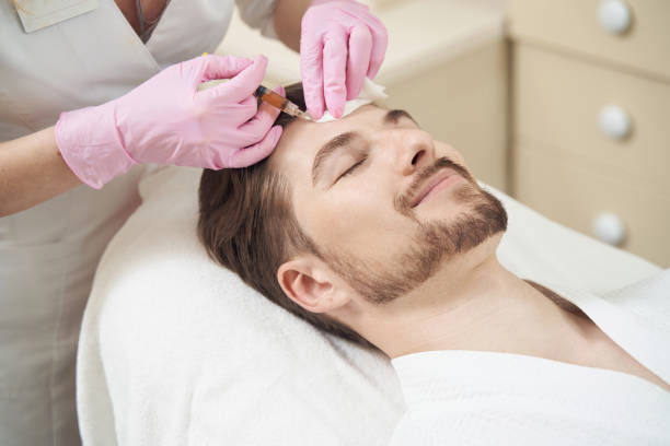 istock Patient feeling satisfied during plasmolifting facial procedure 1400996781