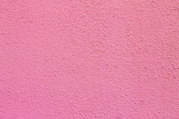 istock Blank concrete wall pink color texture background. Wall embossed texture 1400996995