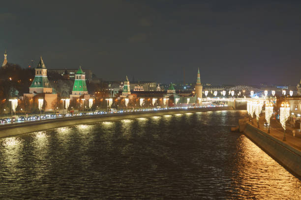 Long exposure image of Moscow cityscape. Image of famous Kremlin Tower, Moskva River in the winter night. The beauty of the capital of the Russian Federation