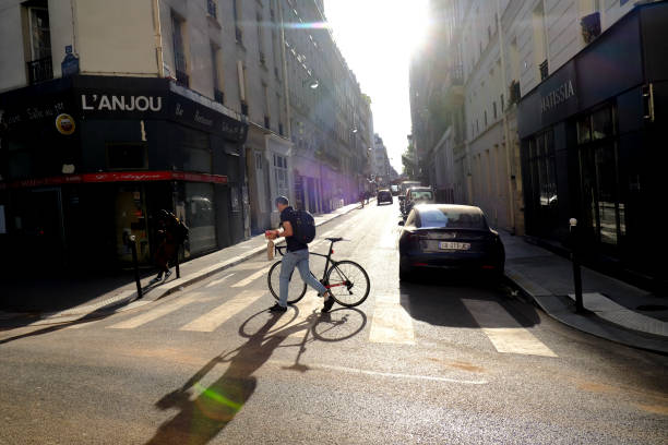 People ride their bikes during a sunny day in in Paris, France on April 23, 2022.