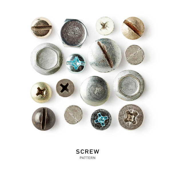 Screw heads creative pattern on white background Screw heads, nuts, rivets pattern isolated on white background. Vintage tools creative layout and composition. Top view, flat lay. Design element rust germany stock pictures, royalty-free photos & images
