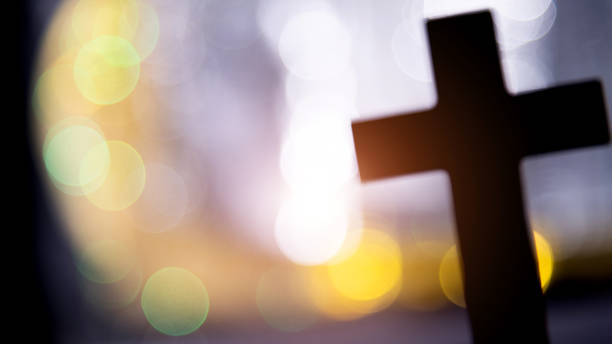 istock Backgrounds of religious cross and defocused lights 1401005481