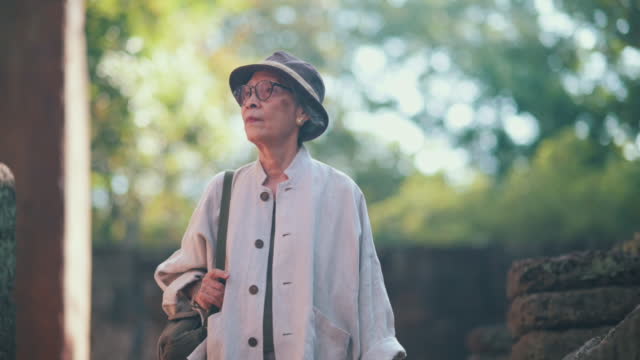 Healthy senior Asian woman travel alone