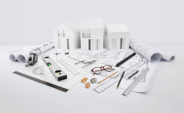 istock architectural model of houses on blueprint with measurement and drawing technical tools, desk for building construction plan, interior designer and architect work, isolated on white background 1401006449