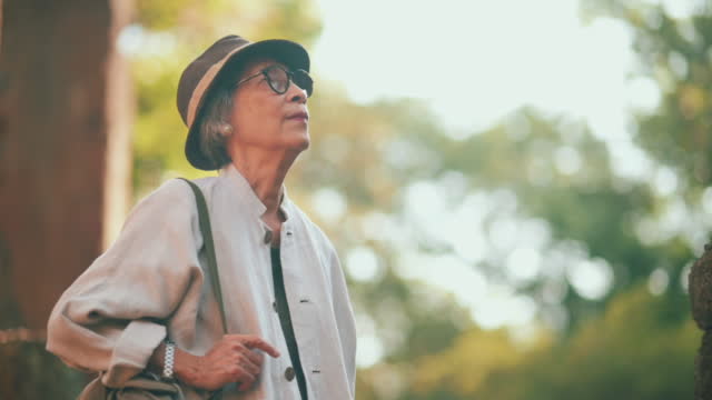 Healthy senior Asian woman travel alone