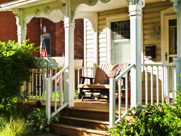 Pretty front porch Pretty front porch in a small American village front porch stock pictures, royalty-free photos & images