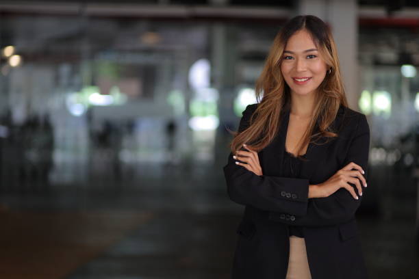 Portrait of a happy charming business woman looking at the camera in the office. Portrait of a happy charming business woman looking at the camera in the office. real estate agent stock pictures, royalty-free photos & images