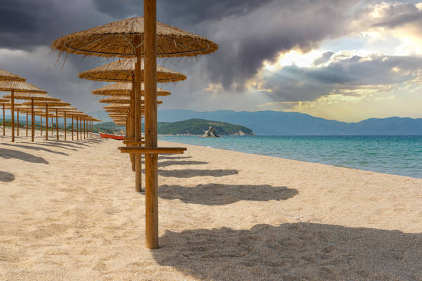 istock beach with umbrellas before rain or storm in bright colors 1401011162