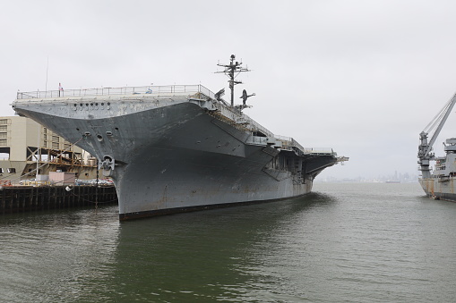 Aerial view of naval ship travelling in San Diego Bay, San Diego, California, USA.