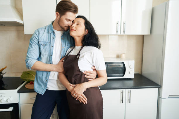 istock Man in love hugging his life partner 1401020786