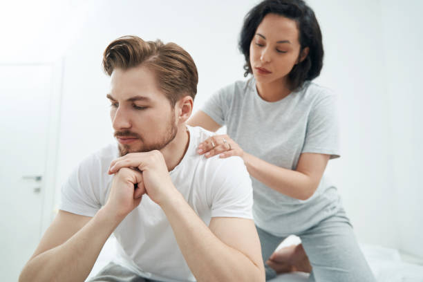 istock Affectionate lady giving her life partner relaxing massage 1401020948