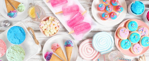 istock Pastel summer sweets table scene top view banner 1401022023