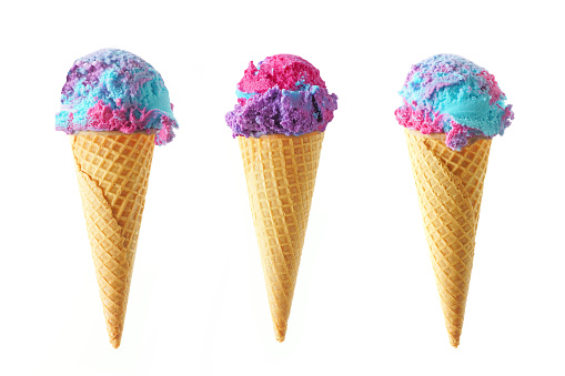 Three cotton candy flavored ice cream cones isolated on white