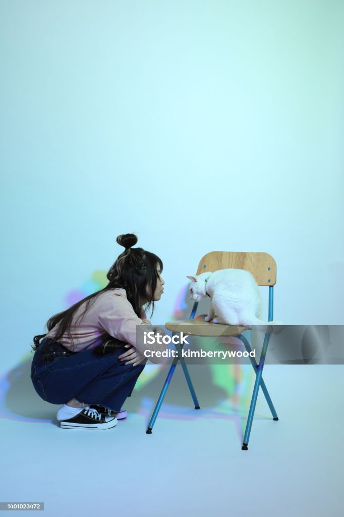 Red Green Blue The cute young Asian girl with casual clothes posing under the gel color lightning in studio. 16-17 Years Stock Photo