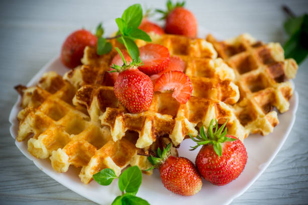 istock Sweet curd cooked waffles with fresh ripe strawberries 1401024389
