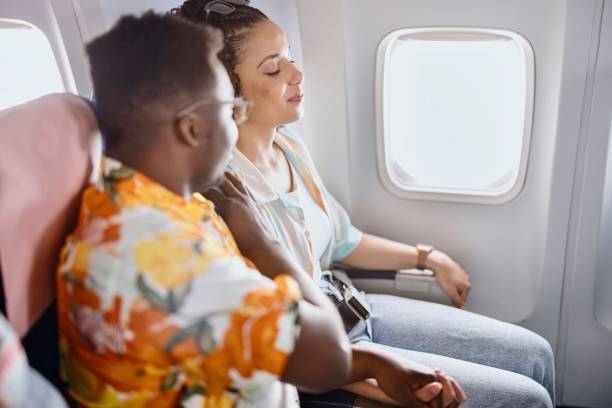istock Young woman experiencing aerophobia while traveling by plane 1401027299