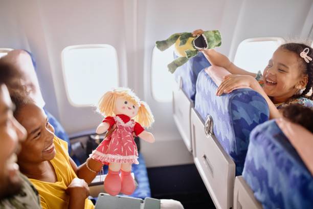 istock The sisters play with plush toys while traveling by plane 1401027504