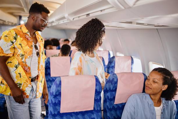 istock The couple finds their seats on the plane 1401027630