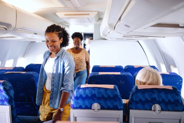 istock Passengers boarding plane and searching for their sets 1401029136