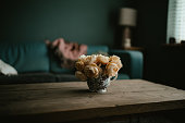 istock Vase of peach coloured roses in a vase 1401033497