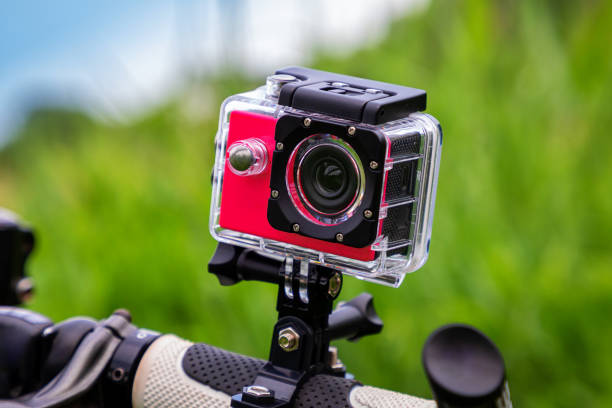 istock Action camera on a green background on a sunny day. 1401034940