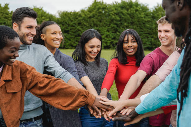 istock Young multiethnic group of people stacking hands together outdoor - Teamwork diversity and unity concept 1401036853